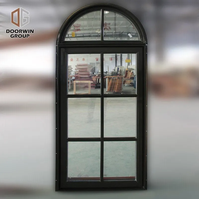 Round top fixed window and bottom crank open window with decorative glazing bars