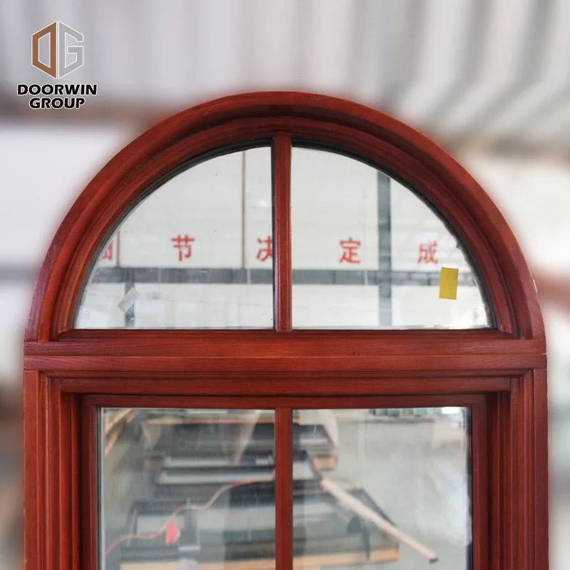 Round top fixed window and bottom crank open window with decorative glazing bars