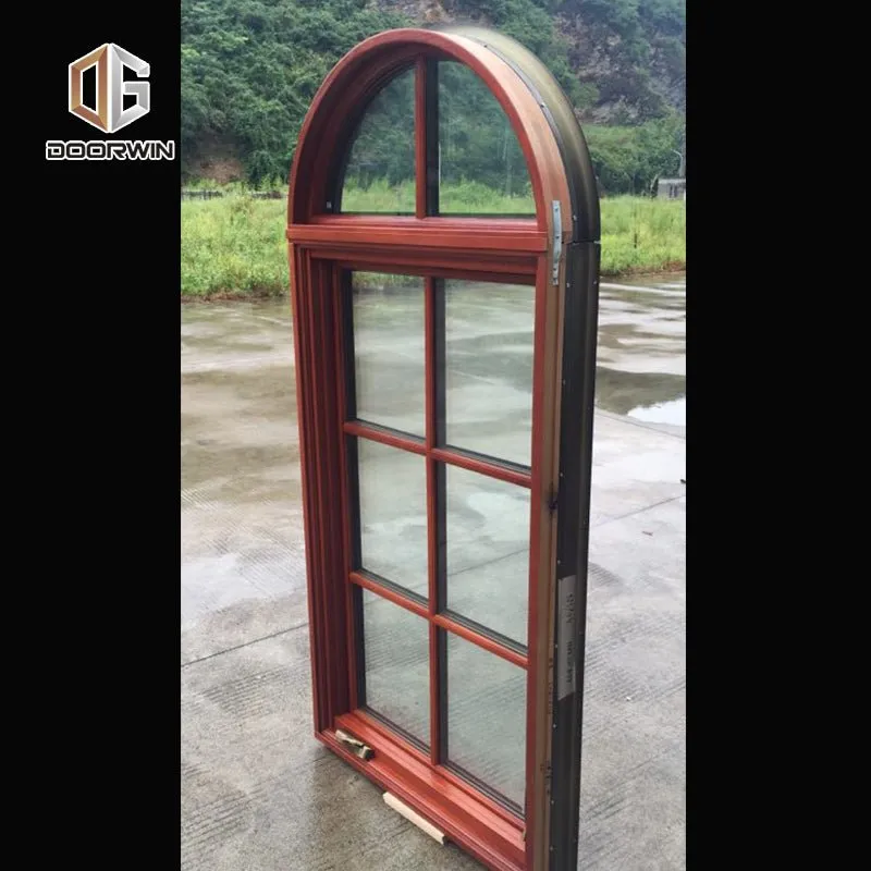 Round top fixed window and bottom crank open window with decorative glazing bars