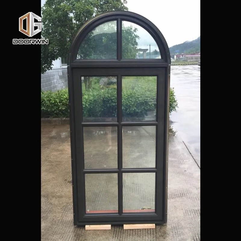 Round top fixed window and bottom crank open window with decorative glazing bars