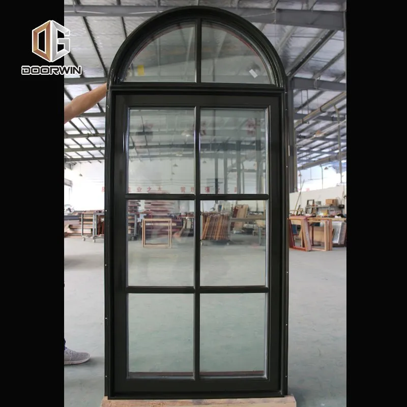 Round top fixed window and bottom crank open window with decorative glazing bars