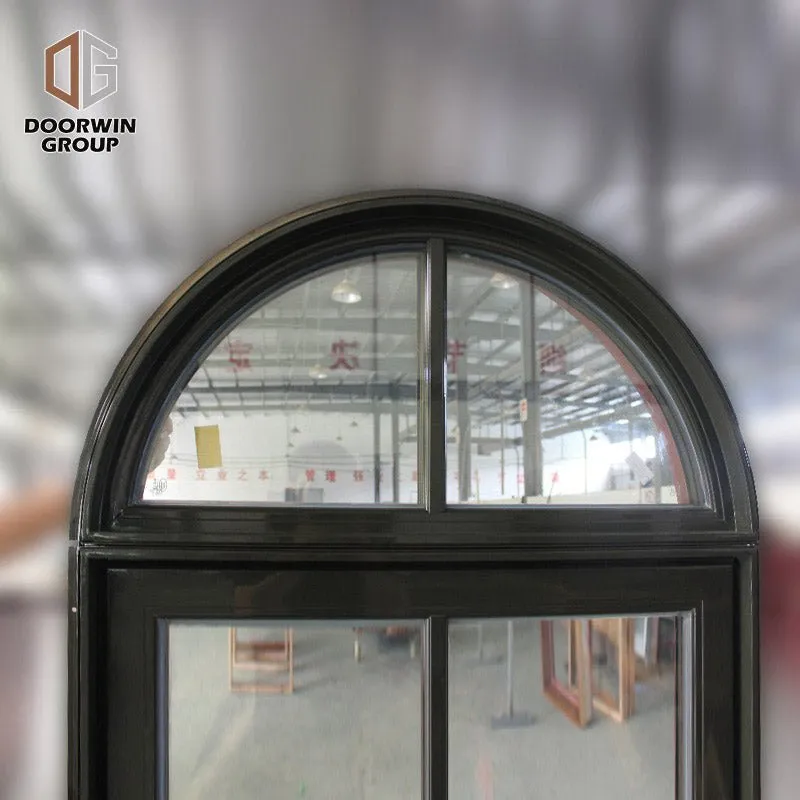 Round top fixed window and bottom crank open window with decorative glazing bars