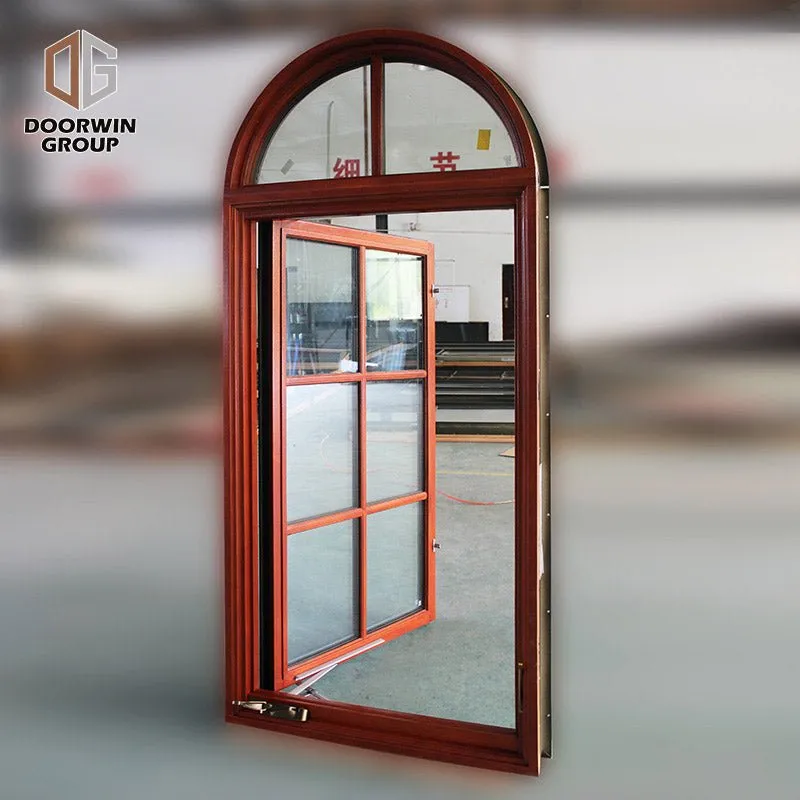 Round top fixed window and bottom crank open window with decorative glazing bars